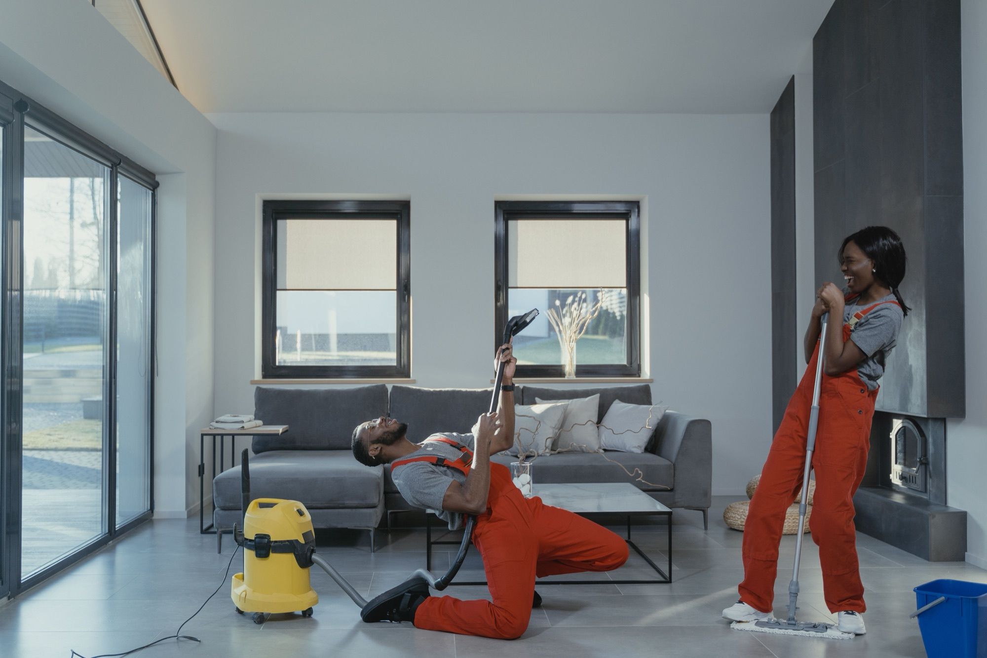 Super Cleaning employees at work in a bright open-plan living room